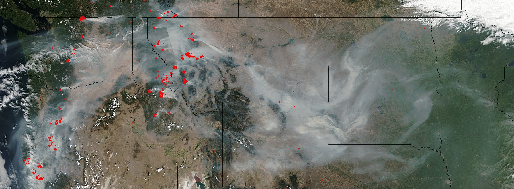 A satellite image of wildfires across the western United States in summer, 2017. Source: NASA